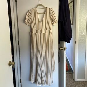 White and tan striped jumpsuit. Tie waist